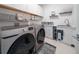 Modern laundry room with Samsung washer and dryer at 16548 Raven Rock Pl, Winter Garden, FL 34787