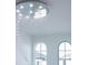 Living room with a dramatic crystal chandelier and arched windows at 16548 Raven Rock Pl, Winter Garden, FL 34787