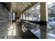 Modern outdoor kitchen with granite countertops and stainless steel appliances at 16548 Raven Rock Pl, Winter Garden, FL 34787