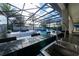Granite countertop outdoor kitchen with pool views at 16548 Raven Rock Pl, Winter Garden, FL 34787