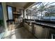 Stainless steel appliances and granite countertops in outdoor kitchen at 16548 Raven Rock Pl, Winter Garden, FL 34787