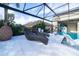 Relaxing wicker lounge chairs near the pool at 16548 Raven Rock Pl, Winter Garden, FL 34787