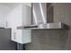 Stainless steel KitchenAid range hood above the cooktop at 16548 Raven Rock Pl, Winter Garden, FL 34787