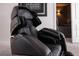 High-end black massage recliner in a media room at 16548 Raven Rock Pl, Winter Garden, FL 34787