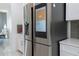 Smart refrigerator with touchscreen and water dispenser at 16548 Raven Rock Pl, Winter Garden, FL 34787