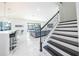 Modern staircase with black and white accents at 16548 Raven Rock Pl, Winter Garden, FL 34787