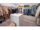 Large walk-in closet with ample shelving and hanging space at 16548 Raven Rock Pl, Winter Garden, FL 34787