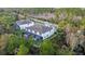 Aerial view showing a townhouse community near a tranquil lake and conservation area at 17354 Blessing Dr, Clermont, FL 34714