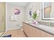 Modern bathroom with dual sinks and a glass shower at 17354 Blessing Dr, Clermont, FL 34714