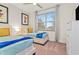Bright bedroom with two twin beds and large window at 17354 Blessing Dr, Clermont, FL 34714