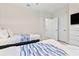 Bedroom with twin beds and access to hallway at 17354 Blessing Dr, Clermont, FL 34714