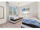 Guest bedroom with twin beds and window at 17354 Blessing Dr, Clermont, FL 34714