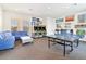 Community game room features ping pong, arcade games, and comfortable seating at 17354 Blessing Dr, Clermont, FL 34714