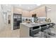 Modern kitchen with stainless steel appliances and breakfast bar at 17354 Blessing Dr, Clermont, FL 34714