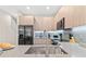 Modern kitchen with stainless steel appliances and a large sink at 17354 Blessing Dr, Clermont, FL 34714