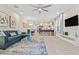 Spacious living room with open concept layout, kitchen, and dining area views at 17354 Blessing Dr, Clermont, FL 34714