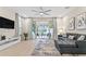 Spacious living room with sliding doors opening to a pool area at 17354 Blessing Dr, Clermont, FL 34714