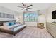 Relaxing main bedroom with large windows, comfy bed, and ample closet space at 17354 Blessing Dr, Clermont, FL 34714