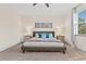 Spacious main bedroom with a king bed, nightstands and large windows at 17354 Blessing Dr, Clermont, FL 34714
