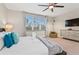King-size bed, large windows, and a dresser in this tranquil main bedroom at 17354 Blessing Dr, Clermont, FL 34714