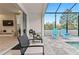Relaxing pool area with patio furniture at 17354 Blessing Dr, Clermont, FL 34714