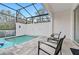 Private screened pool and patio with lounge chairs for ultimate relaxation at 17354 Blessing Dr, Clermont, FL 34714