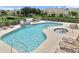 Community pool and spa with plenty of lounge chairs for relaxing at 17354 Blessing Dr, Clermont, FL 34714