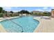 Community pool and spa area with plenty of lounge chairs at 17354 Blessing Dr, Clermont, FL 34714