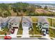 Three homes with two-car garages and manicured lawns at 1791 Yellow Trl, Lakeland, FL 33801