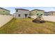 Spacious backyard with playground set and privacy fence at 1791 Yellow Trl, Lakeland, FL 33801
