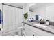 Simple bathroom with granite countertop, single sink, and tub shower at 1791 Yellow Trl, Lakeland, FL 33801