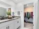 Bathroom boasts double vanity, granite countertops and a walk-in closet at 1791 Yellow Trl, Lakeland, FL 33801