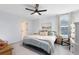 Large bedroom with a plush bed, window with blinds, and ample natural light at 1791 Yellow Trl, Lakeland, FL 33801