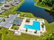 Aerial view of community pool with lounge chairs and surrounding landscape at 1791 Yellow Trl, Lakeland, FL 33801