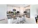 Modern kitchen with white cabinets, granite countertops, and island at 1791 Yellow Trl, Lakeland, FL 33801
