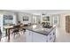 Bright kitchen with granite island, modern appliances, and view of backyard at 1791 Yellow Trl, Lakeland, FL 33801