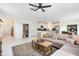 Open concept living room with sectional sofa and kitchen views at 1791 Yellow Trl, Lakeland, FL 33801