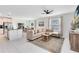 Spacious living room with sectional sofa, coffee table, and large windows at 1791 Yellow Trl, Lakeland, FL 33801