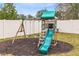 Green and wooden playset with slide and swings at 1791 Yellow Trl, Lakeland, FL 33801