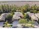 Aerial view showcasing a single-story house, neighborhood homes, and lush green surroundings at 190 Verona Dr, Kissimmee, FL 34759