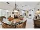 Charming breakfast nook with glass top table and wicker chairs at 190 Verona Dr, Kissimmee, FL 34759