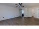 Bright bedroom with wood-look floors, barn door, and spacious closet at 2008 Dixie Belle Ave, Deltona, FL 32725