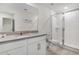 Bright bathroom with a large vanity, sleek shower, and modern fixtures at 2186 Fleming Mist Pl, Kissimmee, FL 34747