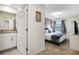 Comfortable bedroom featuring a king bed, stylish lighting, and flat screen television at 2186 Fleming Mist Pl, Kissimmee, FL 34747