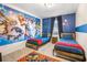 Unique ' bedroom with custom Marvel superhero wall decor, twin beds, and themed rug at 2186 Fleming Mist Pl, Kissimmee, FL 34747