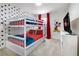 Fun ' bedroom with white bunk beds, a Mickey Mouse decal, and a flat-screen TV at 2186 Fleming Mist Pl, Kissimmee, FL 34747