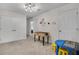 Versatile bonus room with foosball table, playroom area, and ample storage at 2186 Fleming Mist Pl, Kissimmee, FL 34747