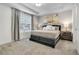 Comfortable main bedroom featuring soft carpet, tray ceilings and natural light at 2186 Fleming Mist Pl, Kissimmee, FL 34747