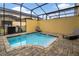 Secluded pool with brick patio, screened enclosure, and relaxing lounge chairs at 2186 Fleming Mist Pl, Kissimmee, FL 34747