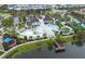 Resort-style community pool, clubhouse, lazy river, splash pad, and dock on the lake at 2186 Fleming Mist Pl, Kissimmee, FL 34747